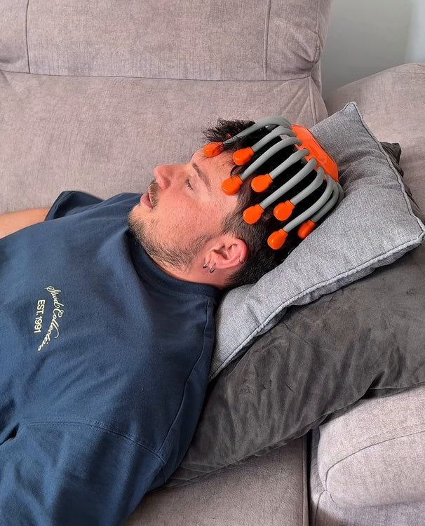 Electric Scalp Massager relaxing on the sofa